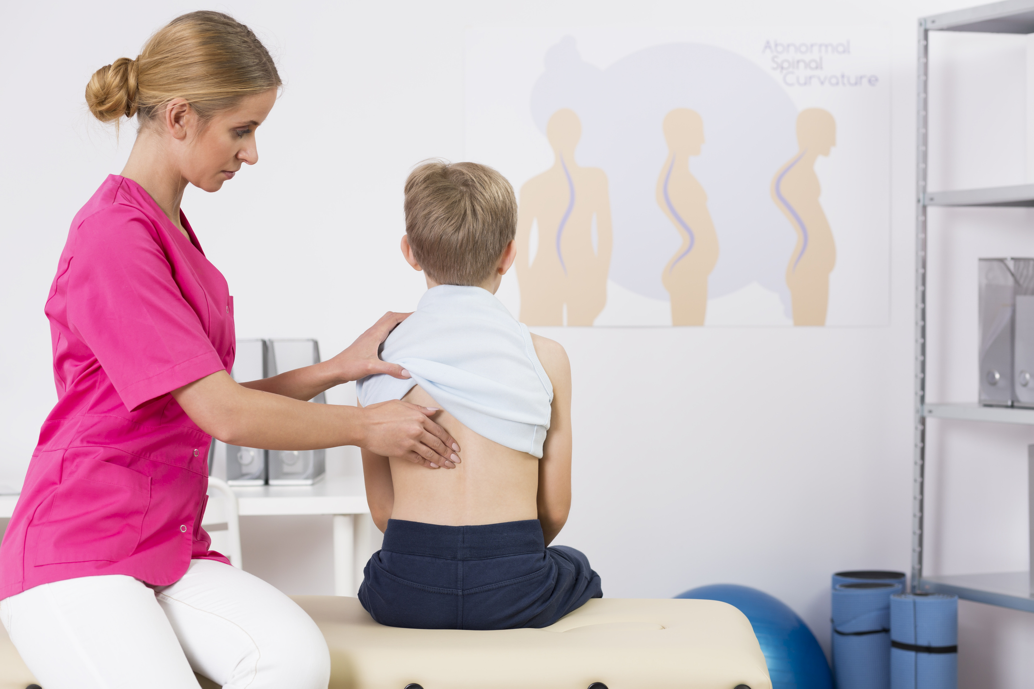 Doctor examining childs posture